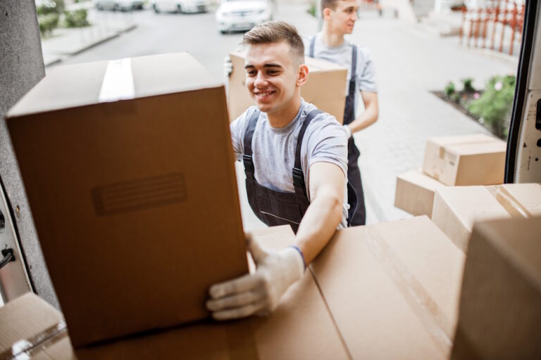 movers putting boxes on truck