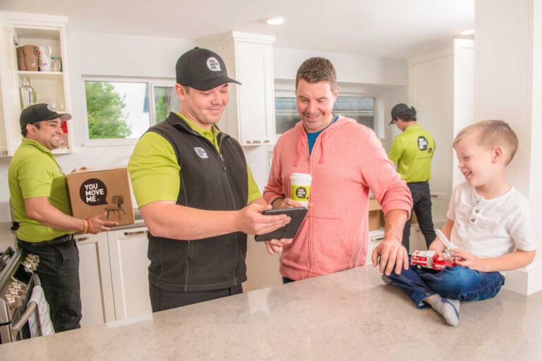 professional mover reviewing estimate with home owner